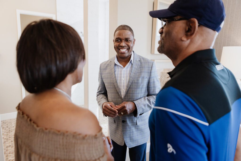 Real estate agent with clients